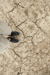 Fototapeta na wymiar Feet on a drought floor