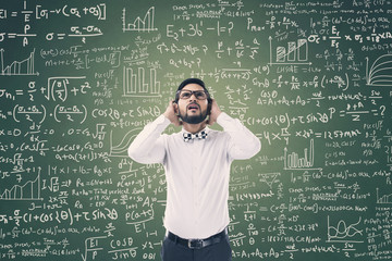 Man solving mathematical equation
