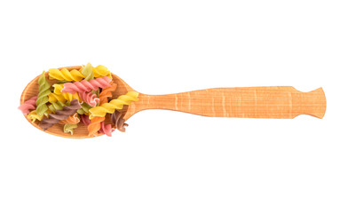 Colorful fusilli pasta in spoon