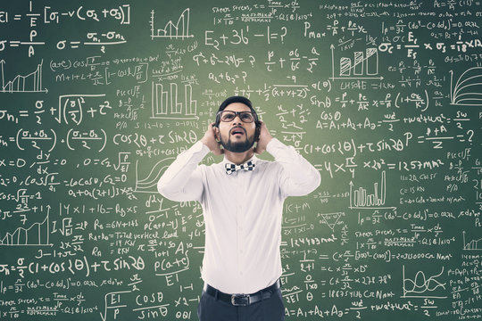Man solving mathematical equation