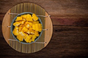 split corn on wood background