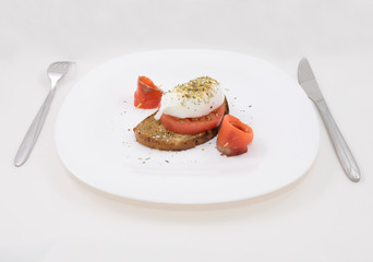 Egg poached with salmon and tomato