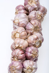 String of garlic isolated on white background