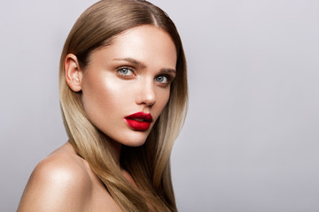 Beautiful young model with red lips and nude manicure - obrazy, fototapety, plakaty