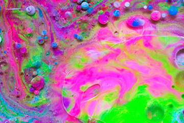 Colourful and beautiful effect of water paint and oil mixing. Multicoloured abstract bubbles.