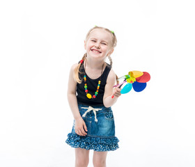 child with a spinner toy, wearing a top