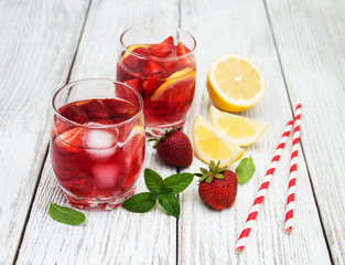 Glasses of lemonade with strawberries