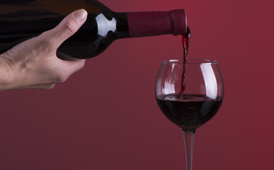 Red wine. Glass of wine. Pouring red wine.