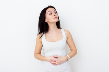 Woman with pain is holding her aching belly
