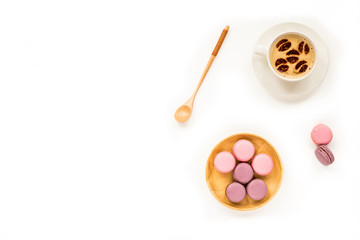 Fototapeta na wymiar Composition with macaroon and cup of cooffee on white background. Flat lay, top view, copy space