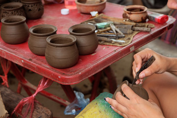 Crafting handmade mud jar