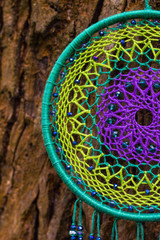 Dreamcatcher made of feathers, leather, beads, and ropes