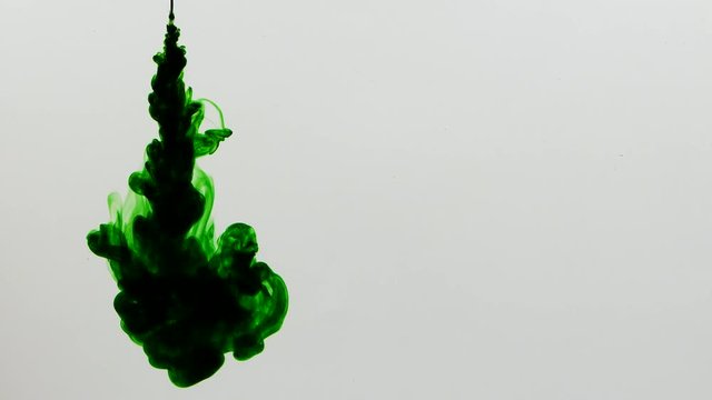 Close-up of the ink poured into the water. Shot with high-speed camera, phantom flexible 4K.