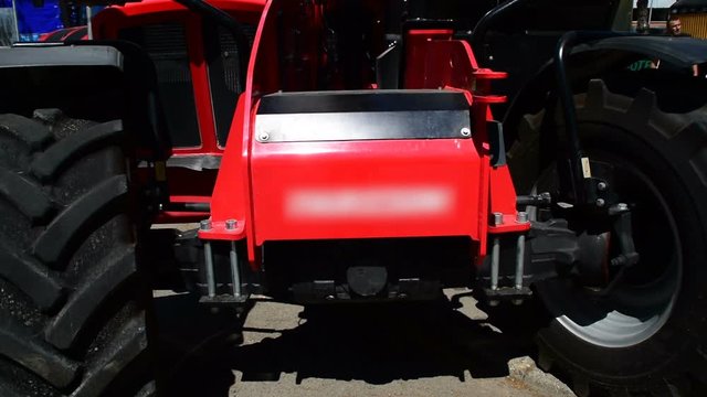 The new tractor with front and back side, and lights on the tractor,three shots