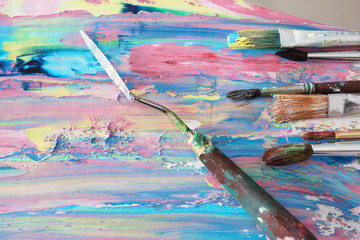 Colorful oil paint with accessories, closeup