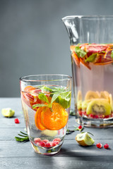 Glass with fresh citrus cocktail on table