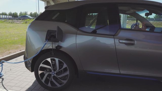 Vilnius, Lithuania - circa June, 2017: Electric car charging from solar panels, pan