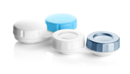 Containers for contact lenses on white background