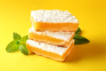 Delicious lemon pie bars stack on colour background