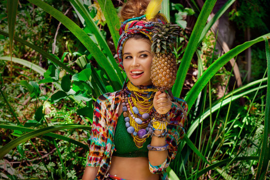 attractive boho woman outdoors at jungle background