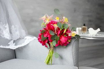 Beautiful flower bouquet on armchair