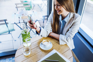 Beautiful Young Woman Having Coffee