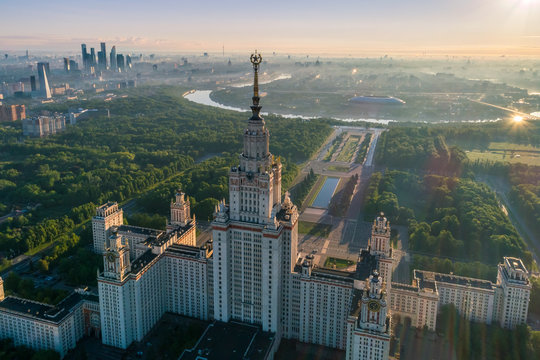 Moscow state university and Moscow city business center at sunrise. City in fog. Russia. Aerial View.