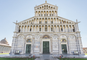 Facade of medieval Roman Catholic cathedral dedicated to Assumption Virgin Mary, in Piazza dei Miracoli in Pisa