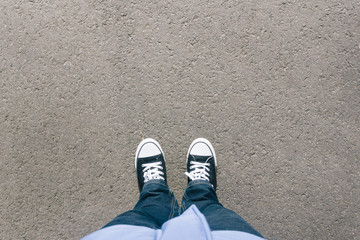 Asphalt with two shoes, high angle from above