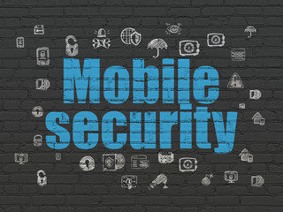 Safety concept: Mobile Security on wall background