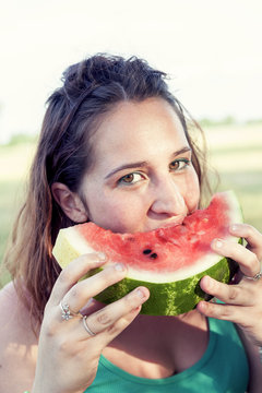 portrait of young pretty woman eating