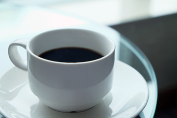 Cup of black coffee served in the morning