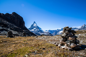 Fototapeta na wymiar View of Matterhorn and piles of stones/