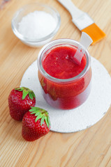 Strawberry puree and sugar for preparing facial mask or scrub. Homemade cosmetics
