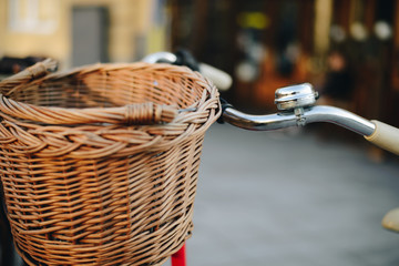 old retro bike with basket in stand on bike park in the city