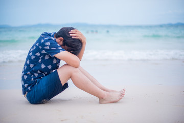 Sad man worried on the beach koh larn island, Pattaya,Chonburi,Thailad, Beach travel.