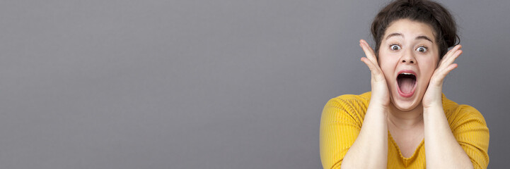 happy xxl girl with yellow sweater, long grey banner