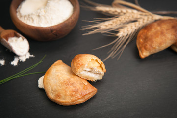 Bakery background – home made cheese pie on black board