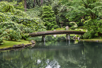 Fototapeta na wymiar Wood Bridge in Japanese Garden