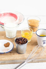 Baking ingredients for pastry on white wooden rustic table. Step by step recipe. 