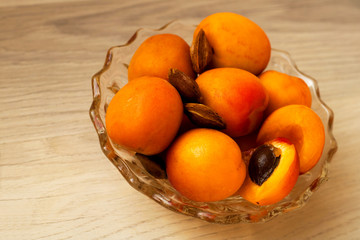 Apricots and some kernels of apricot in a bowl