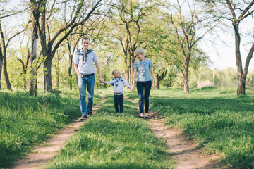 Fototapeta premium happy young family have fun in prak