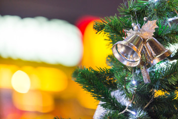 christmas tree and decorations on color bokeh background