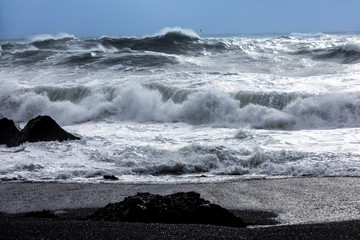waves on the black beach of Reynisfjara in Iceland