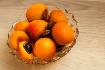 Apricots in bowl - whole and some kernels of apricots