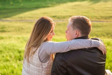 Portrait of couple hugging in nature back view