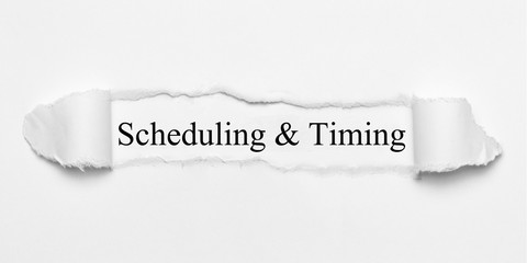 Scheduling & Timing on white torn paper