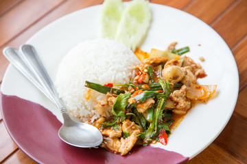 Rice topped with stir-fried pork and basil