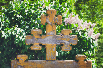 Beautiful old wooden cross in the old cemetery, Russia.