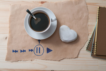 white coffee cup and gingerbread on wooden desk